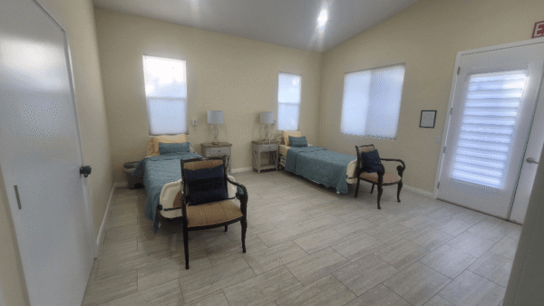 Two beds in one of the rooms of the Facility